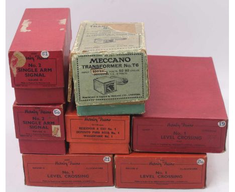 A small collection of Hornby 0 gauge accessories, to include three no.1 level crossings, two no.2 single signals, a no.1 wate