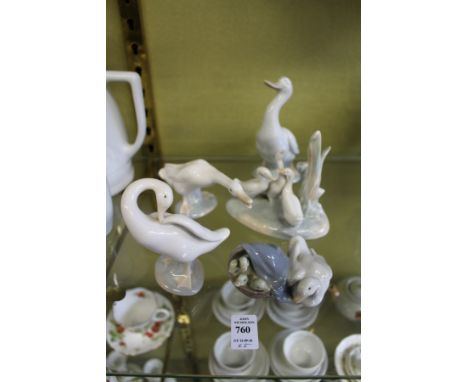 Five Lladro and Nao porcelain groups of geese.