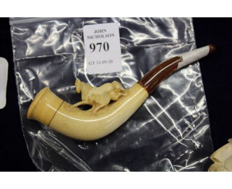 A small Meerschaum pipe.