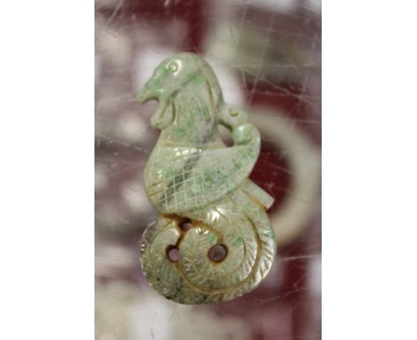 A Chinese carved jade bird shaped amulet.