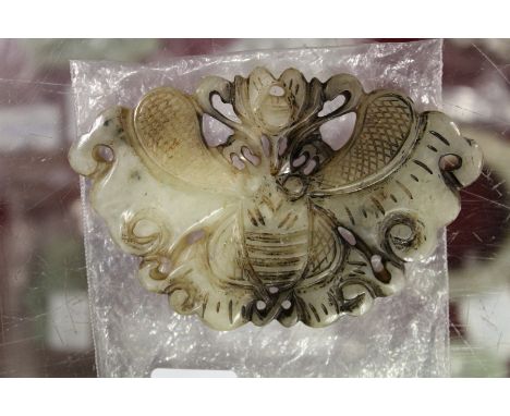 A Chinese carved jade butterfly pendant.