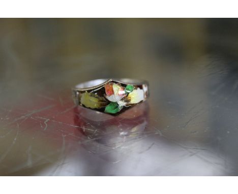 A silver and enamel ring.