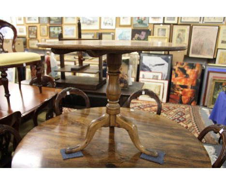 A 19th century mahogany tripod table.