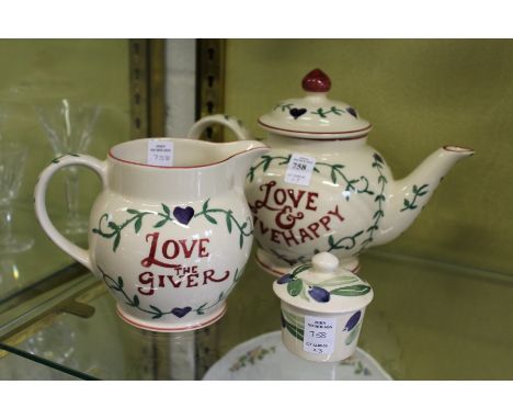 An Emma Bridgewater teapot and matching jug and similar item.