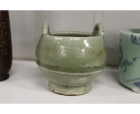 A Chinese sang style celadon porcelain candlestick holder.