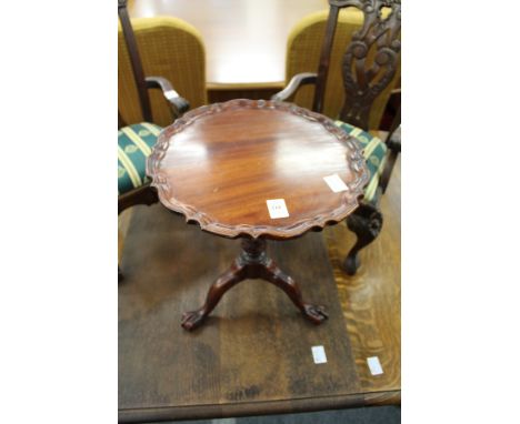 A Chippendale style miniature mahogany tilt top tripod table.