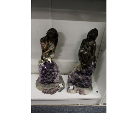 An unusual pair of amethyst and bronze colour female figure groups.