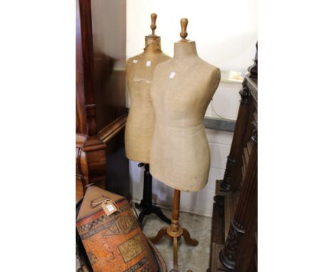 Two Victorian dressmaker's mannequins on tripod bases.