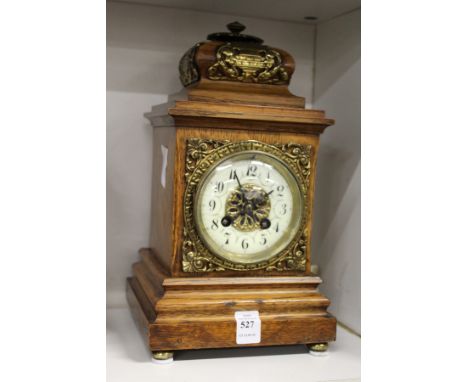 An oak cased mantle clock.