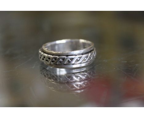 A decorative silver ring.