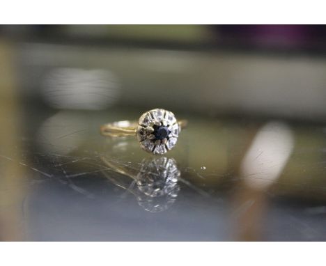 An 18ct gold diamond and sapphire ring.