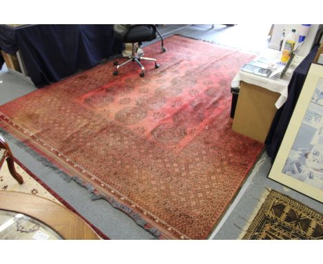 A good large red ground Bokhara style carpet.