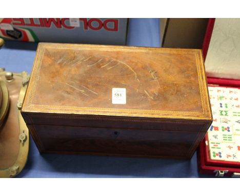 A Georgian mahogany tea caddy.