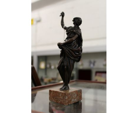 A small classical bronze figure on a marble base.