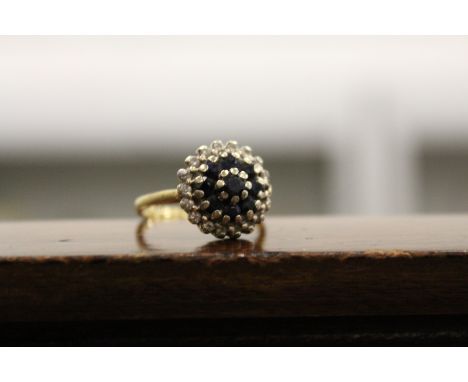 A good gold, diamond and sapphire cluster ring.