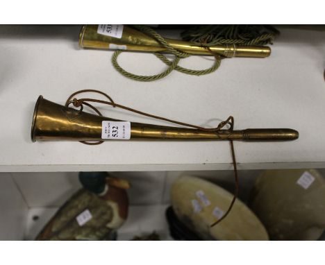 A brass hunting horn.
