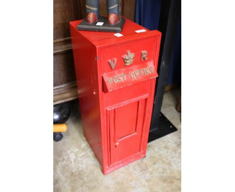 A Victorian style post box with stand.