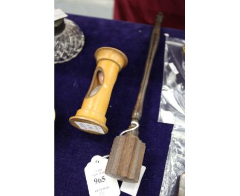 A turned wood stirring stick and an egg timer.