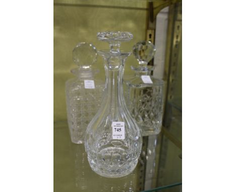 Two cut glass whisky decanters and a sherry decanter.