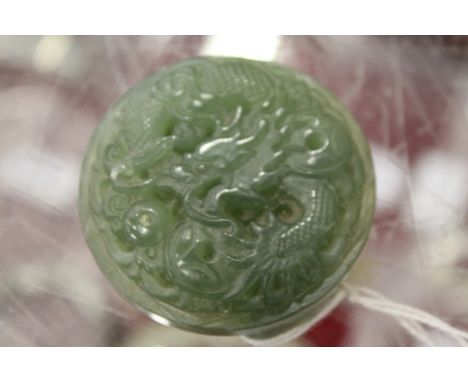 A Chinese carved jade buckle.
