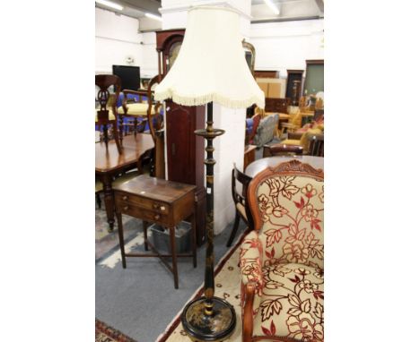 A chinoiserie decorated black lacquer standard lamp.