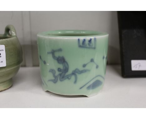 An oriental blue and celadon glazed tripod censer.