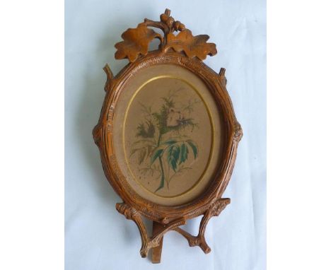 OVAL OLIVE WOOD EASEL TYPE PHOTO FRAME DECORATED WITH OAK LEAVES AND ACORNS