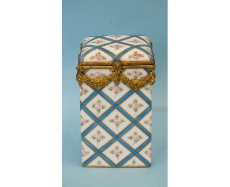 A Limoges ceramic box of oblong form, with gilt metal mounts, painted with roses and blue lattice design, 11cm high, 7cm squa
