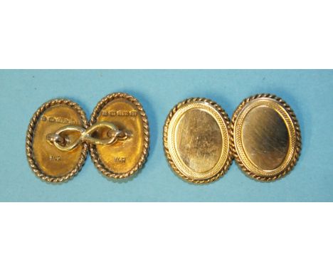 A pair of 15ct gold oval cufflinks with engine-turned and rope-twist borders, 9.6g. 