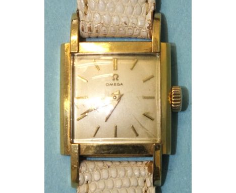 Omega, a lady's late-1950's 18ct gold-cased wrist watch, the square silvered dial with baton numerals, with cal. 244 movement