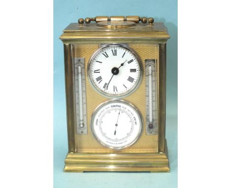 A French gilt brass compendium carriage clock, the moulded edge case inset with a silvered compass under the hinged carrying 