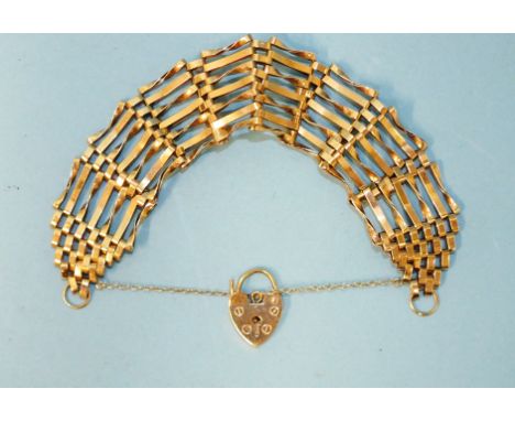 A 9ct gold gate-link bracelet with padlock clasp, 2.3cm wide, 14.2g. 