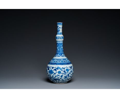 Fullt title: A Chinese blue and white bottle vase with floral design, KangxiDescription: H.: 42,5 cm Condition: (UV-checked)-