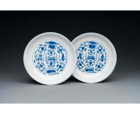 Fullt title: A pair of Chinese blue and white 'antiquities' plates, Kangxi mark and of the periodDescription: Dia.: 16 cm Con
