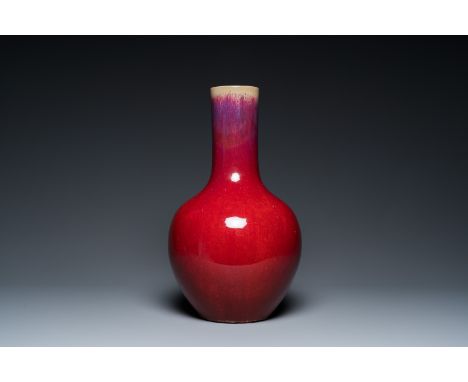 Fullt title: A Chinese flambŽ-glazed bottle vase, 19th C.Description: H.: 41 cm Condition: (UV-checked)- The rim partly resto