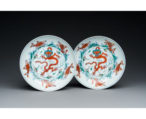 Fullt title: A pair of Chinese doucai 'dragon' plates, Chenghua mark, KangxiDescription: Dia.: 20,5 cm Ref.: Christie's, New 