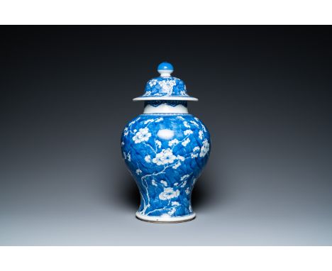 Fullt title: A Chinese blue and white 'prunus on cracked ice' vase and cover, KangxiDescription: H.: 44,5 cm Condition: (UV-c