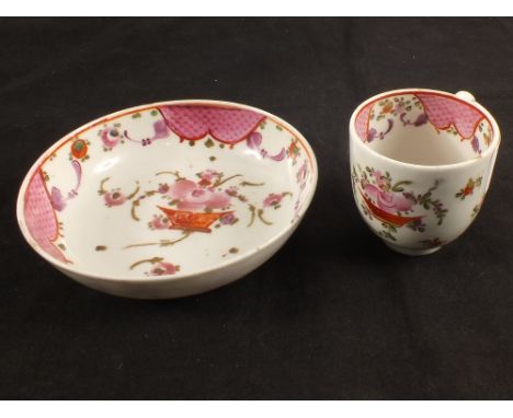 A Lowestoft polychrome cup and saucer with floral basket pattern decoration and pink scale reserve border, cup height 2 1/4",