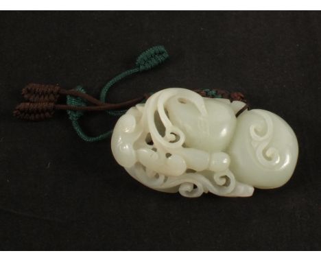 A Chinese carded Jade peach pendant