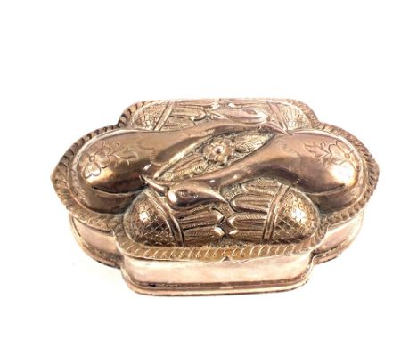 A white metal trinket box with bird decorated lid