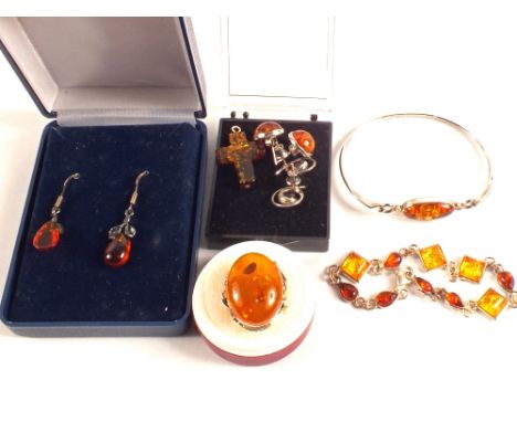 A quantity of Silver mounted Amber set jewellery including ring, earrings, bangle and bracelet etc