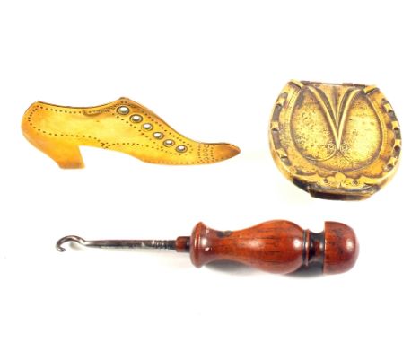 Avery horseshoe needle case and a Brass boot wooden handled button hook
