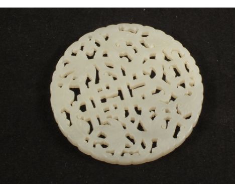 A Chinese carved Jade double happiness circular pendant