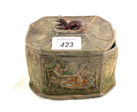 A Georgian lead tobacco jar with figural design and greyhound finial, traces of green paint