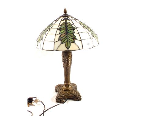 A table lamp with Tiffany style shade