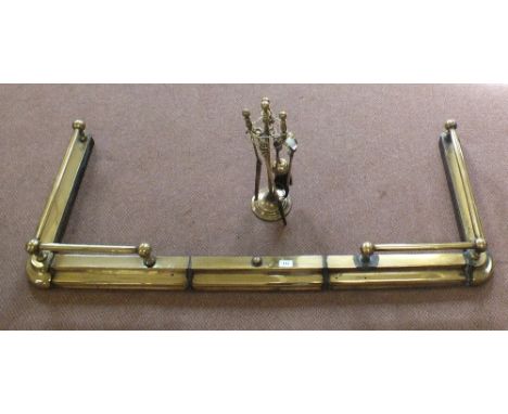 A Brass fender plus companion set