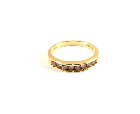 An 18ct Gold ring set with eight small Diamonds, size K
