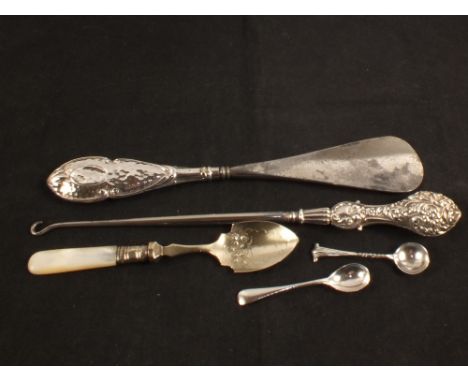 Two Silver salt spoons (one London hallmark 1905), a Silver shoe horn, hallmarked 1900, a Silver button hook, hallmarked 1900