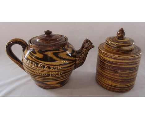 Edwardian slipware double spout teapot 'Mrs H D Marsh, November 1911' and a similar lidded jar inscribed C Hammon Feb 1912 to