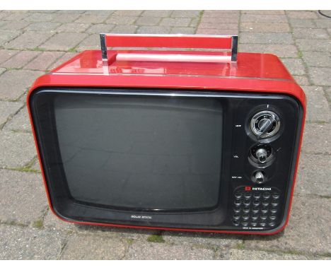 Hitachi solid state transistor portable TV with red plastic case model no F-54G-311 L 41 cm H 31 cm (no lead)